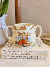 Load image into Gallery viewer, Bunnykins Royal Doulton "Bunny to the Town Station" Two handled Mug 2441