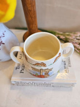 Load image into Gallery viewer, Bunnykins Royal Doulton &quot;Bunny to the Town Station&quot; Two handled Mug 2441
